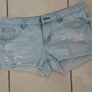 a pair of distressed jean shorts